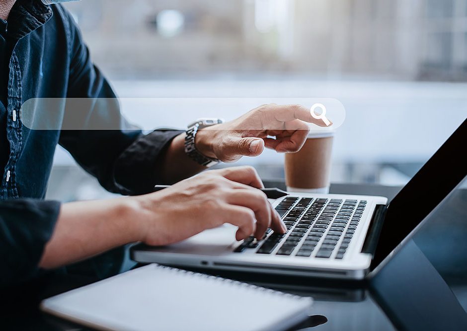 Business man clicking internet search page on computer touch screen at home office.