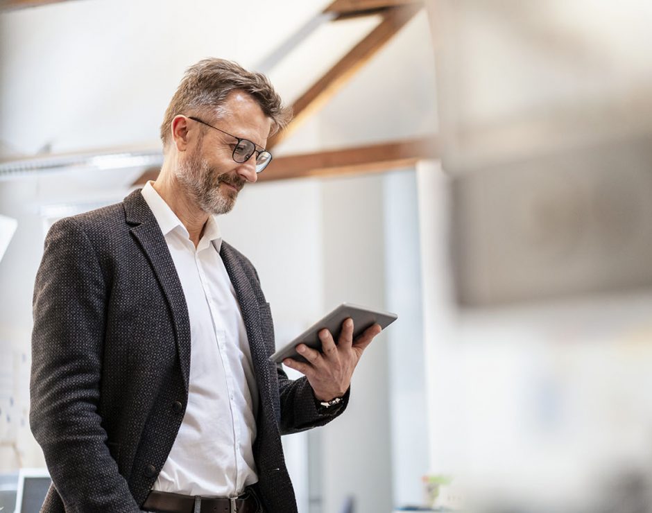 Businessman using tablet in office